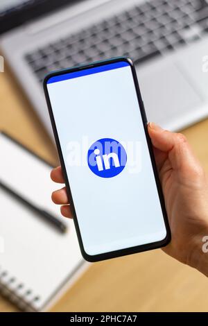 Kyiv, Ukraine - Mar. 20th, 2023: Application in the phone LinkedIn, social network. Stock Photo