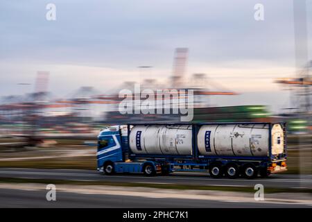 Container truck, bringing containers to Euromax Container Terminal, the seaport of Rotterdam, the Netherlands, deep sea port Maasvlakte 2, on a man-ma Stock Photo