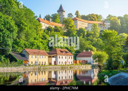 Jakobinka Tower - a remnant of the extinct Upper Rozmberk Castle. Morning view from the Vltava riverbank in Rozmberk nad Vltavou, Czech Republic Stock Photo