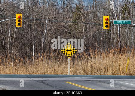 Traffic lights. Many roads have intersections with traffic lights that regulate traffic in and out of the city. This is road safety. Stock Photo