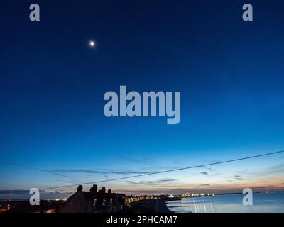 Sheerness, Kent, UK. 27th Mar, 2023. UK Weather: five planets aligned with the crescent moon in the night sky above Sheerness, Kent this evening. Pic: Mars, Moon, Venus. Credit: James Bell/Alamy Live News Stock Photo