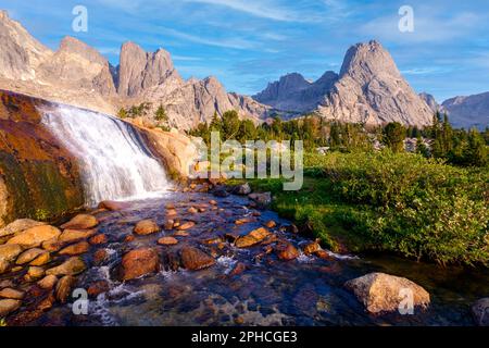 A Waterfall Among Steep Granite Mountains. Cirque of Towers, Wind River Range, Wyoming Stock Photo