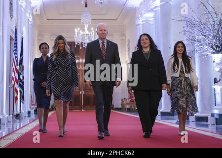 Washington, United States. 27th Mar, 2023. U.S. President Joe Biden joined by Administrator of the Small Business Administration (SBA) Isabella Casillas Guzman (2nd R) arrives at the SBA Women's Business Summit in the East Room of the White House in Washington, DC on Monday, March 27, 2023. (Photo by Oliver Contreras/UPI Credit: UPI/Alamy Live News Stock Photo