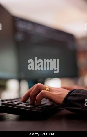 System engineer writing programming language on computer, using database code to develop server interface. Freelance coder analyzing html script working in it development agency. Close up Stock Photo