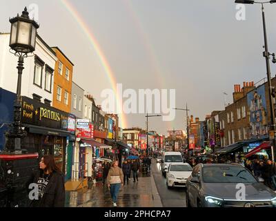 A colourful double rainbow over Camden High Street in London on a wet day in March 2023 Stock Photo