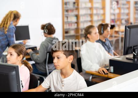 Portrait of a ten-year-old schoolboy holding textbooks Stock Photo - Alamy