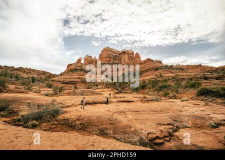 People hiking up Cathedral Rock Trail in Sedona Arizona on perfect day. Stock Photo