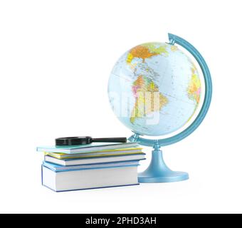 Plastic model globe of Earth, books and magnifying glass on white background. Geography lesson Stock Photo