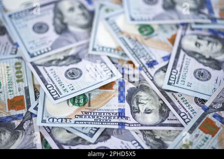 100 dollar bills background with shallow depth of field Stock Photo