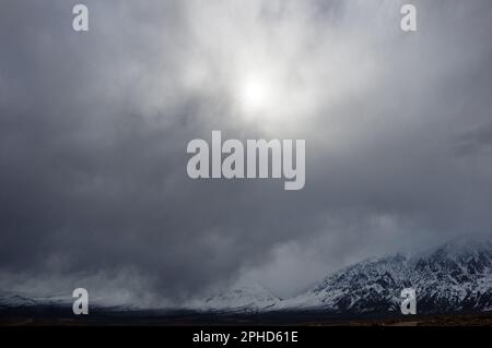 stormy gray winter sky over Round Valley and the Sierra Nevada Mountains Stock Photo