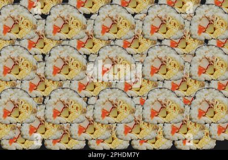 background kimbap or gimbap is Korean roll Gimbap(kimbob) made from steamed white rice (bap) and various other ingredients. Stock Photo