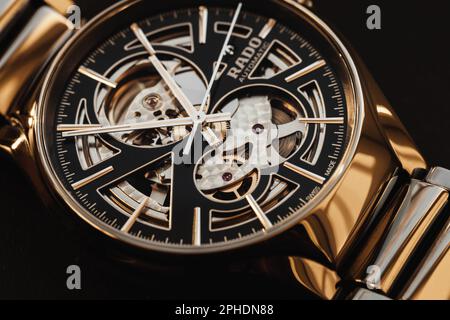 Lengnau, Switzerland - November 11, 2021: Macro photo of luxury Swiss made mechanical wrist watch with black deal and body made of black ceramics. Rad Stock Photo