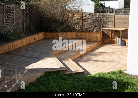 wooden terrace different levels in the garden of the house Stock Photo