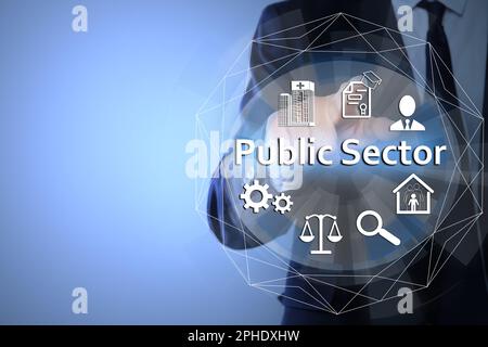 Public Sector concept. Man pointing at virtual screen with different icons on light blue background, closeup Stock Photo