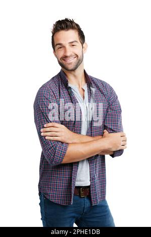 Friendliness will take you everywhere. Studio shot of a young man posing against a white background. Stock Photo