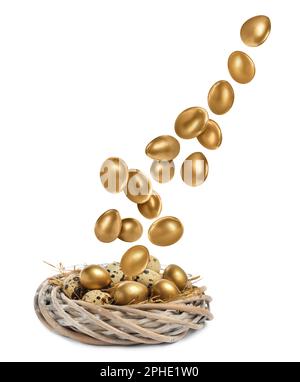 Shiny golden eggs falling into nest on white background, top view Stock Photo