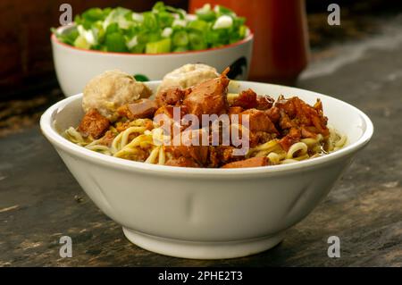 Indonesian street food, Mie Ayam, noodles with chicken Stock Photo