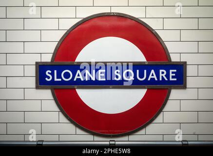 The iconic London Underground station name design for Sloane Square tube station in southwest London. The London Underground roundel, was designed by Stock Photo