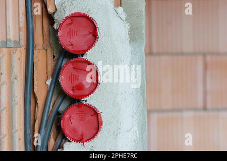 Installation of flush-mounted boxes in a new building Stock Photo