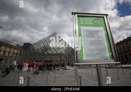 Paris, France. 27th Mar, 2023. A service suspension notice is seen during protestors' blockage of entrance to the Louvre Museum to demonstrate against government's pension reform, in Paris, France, on March 27, 2023. Credit: Gao Jing/Xinhua/Alamy Live News Stock Photo