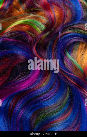 Abstract background of multicolored vibrant soft hair locks in mess Stock Photo