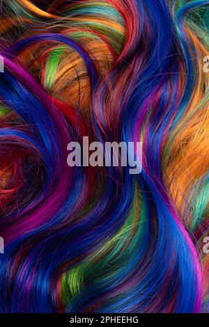 Abstract background of multicolored vibrant soft hair locks in mess Stock Photo