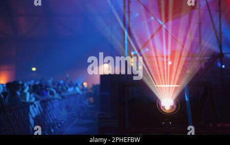 Colorful beams of bright laser light illuminating music venue during performance Stock Photo