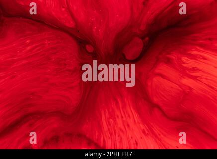 Beautiful abstraction of liquid paints in slow blending flow mixing together gently Stock Photo