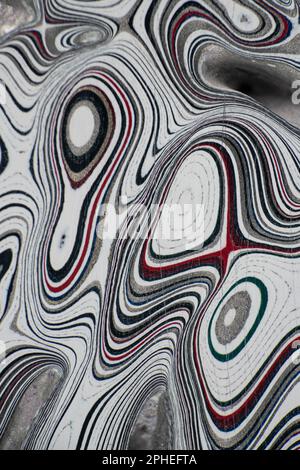 Fordite, also known as Motor or Detroit Agate, is a unique automotive enamel material with an interesting history. The original layered automotive pai Stock Photo