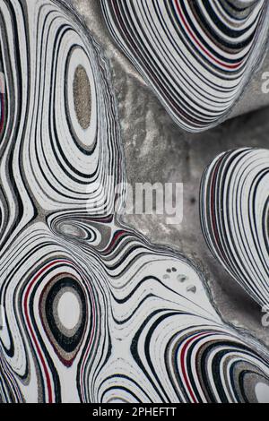 Fordite, also known as Motor or Detroit Agate, is a unique automotive enamel material with an interesting history. The original layered automotive pai Stock Photo