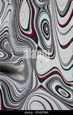 Fordite, also known as Motor or Detroit Agate, is a unique automotive enamel material with an interesting history. The original layered automotive pai Stock Photo