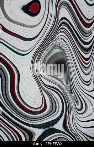 Fordite, also known as Motor or Detroit Agate, is a unique automotive enamel material with an interesting history. The original layered automotive pai Stock Photo