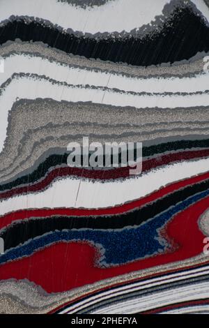 Fordite, also known as Motor or Detroit Agate, is a unique automotive enamel material with an interesting history. The original layered automotive pai Stock Photo