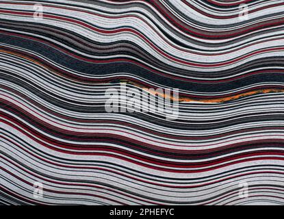 Fordite, also known as Motor or Detroit Agate, is a unique automotive enamel material with an interesting history. The original layered automotive pai Stock Photo