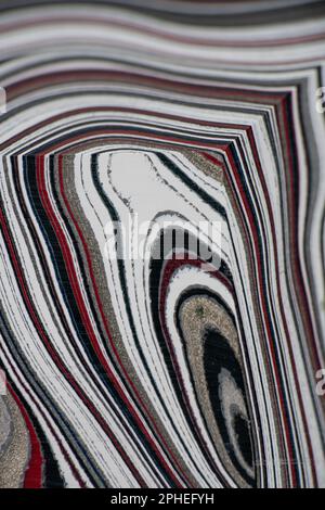 Fordite, also known as Motor or Detroit Agate, is a unique automotive enamel material with an interesting history. The original layered automotive pai Stock Photo