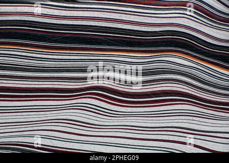 Fordite, also known as Motor or Detroit Agate, is a unique automotive enamel material with an interesting history. The original layered automotive pai Stock Photo