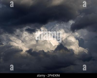 The dark and dramatic background of the storm clouds area. Stock Photo