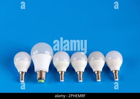 energy-saving LED light bulbs on a blue background Stock Photo