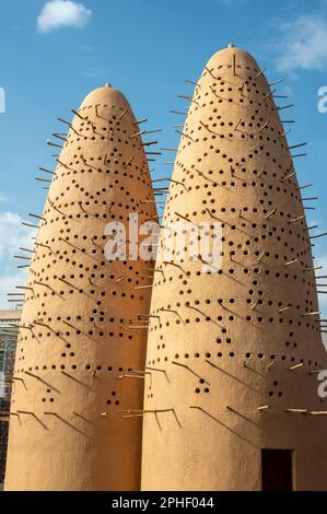 Pigeon Towers in Katara Cultural Village in Doha. Pigeon towers and blue sky near Mosque in Katara, cultural village, Valley of Cultures, West Bay, Do Stock Photo