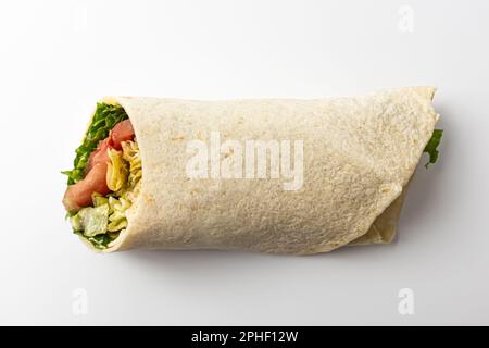 tortilla-wrapped food. food containing chicken. food with fresh vegetables Stock Photo