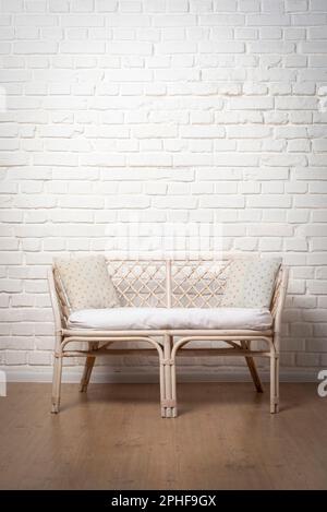 Rattan Living Room Loveseat on white brick wall background Stock Photo ...