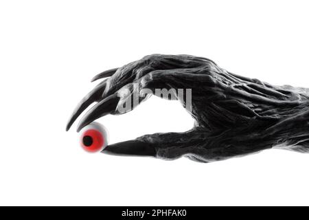 Creepy monster hand with red eyeball isolated on white background with clipping path Stock Photo