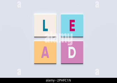 The word lead on pastel colored square blocks. Leadership or lead generation in business marketing concept. Stock Photo