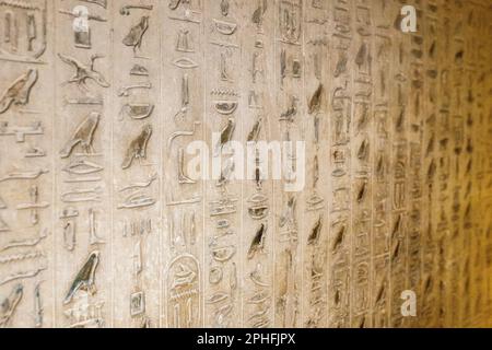 Authentic hieroglyphic inscriptions inside an underground burial chamber in the Pyramid of Unas at the Saqqara Necropolis in Giza, Egypt Stock Photo