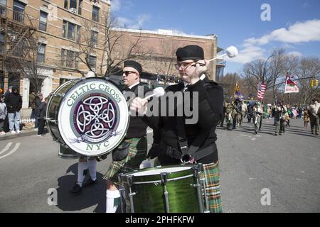 Saint Patrick's Irish Day Parade in the Park Slope neighborhood in Brooklyn, New York. Celtic Cross Pipe Band of New York marches in the parade. Stock Photo