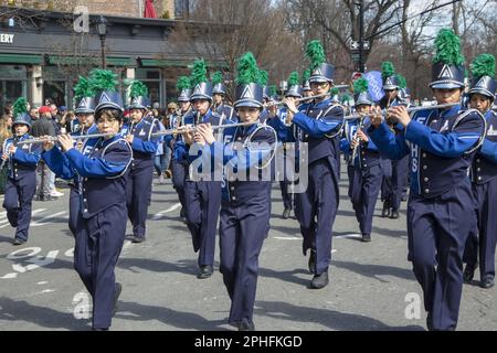 Saint Patrick's Irish Day Parade in the Park Slope neighborhood in Brooklyn, New York. Fort Hamilton High School Marching Band marches and performs in the parade. Stock Photo
