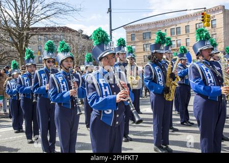 Saint Patrick's Irish Day Parade in the Park Slope neighborhood in Brooklyn, New York. Fort Hamilton High School Marching Band marches and performs in the parade. Stock Photo