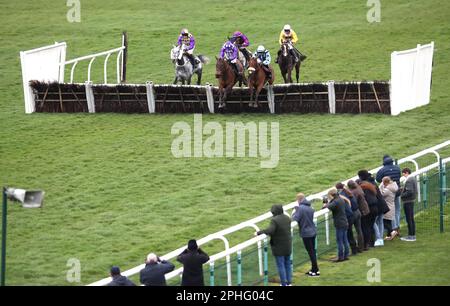 Eyed ridden by jockey Daryl Jacob (centre, in purple) on their way to winning the Racing TV Handicap Hurdle at Huntingdon Racecourse, Cambridgeshire. Picture date: Tuesday March 28, 2023. Stock Photo