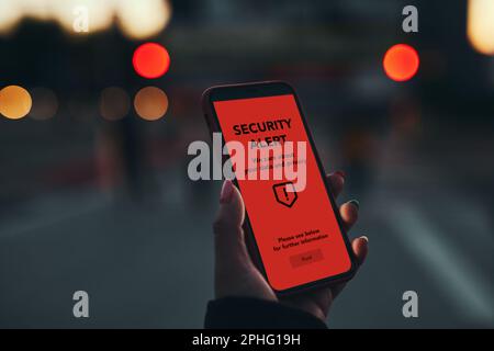 Security alert on smartphone screen. Antivirus warning. Private data protection system notification. Important security issue. Concept of cyber crime, Stock Photo