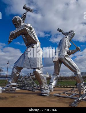 modern stainless steel sculpture The Shipbuilders of Port Glasgow by  artist John McKenna , Coronation Park,Port Glasgow,Inverclyde,Scotland,UK Stock Photo